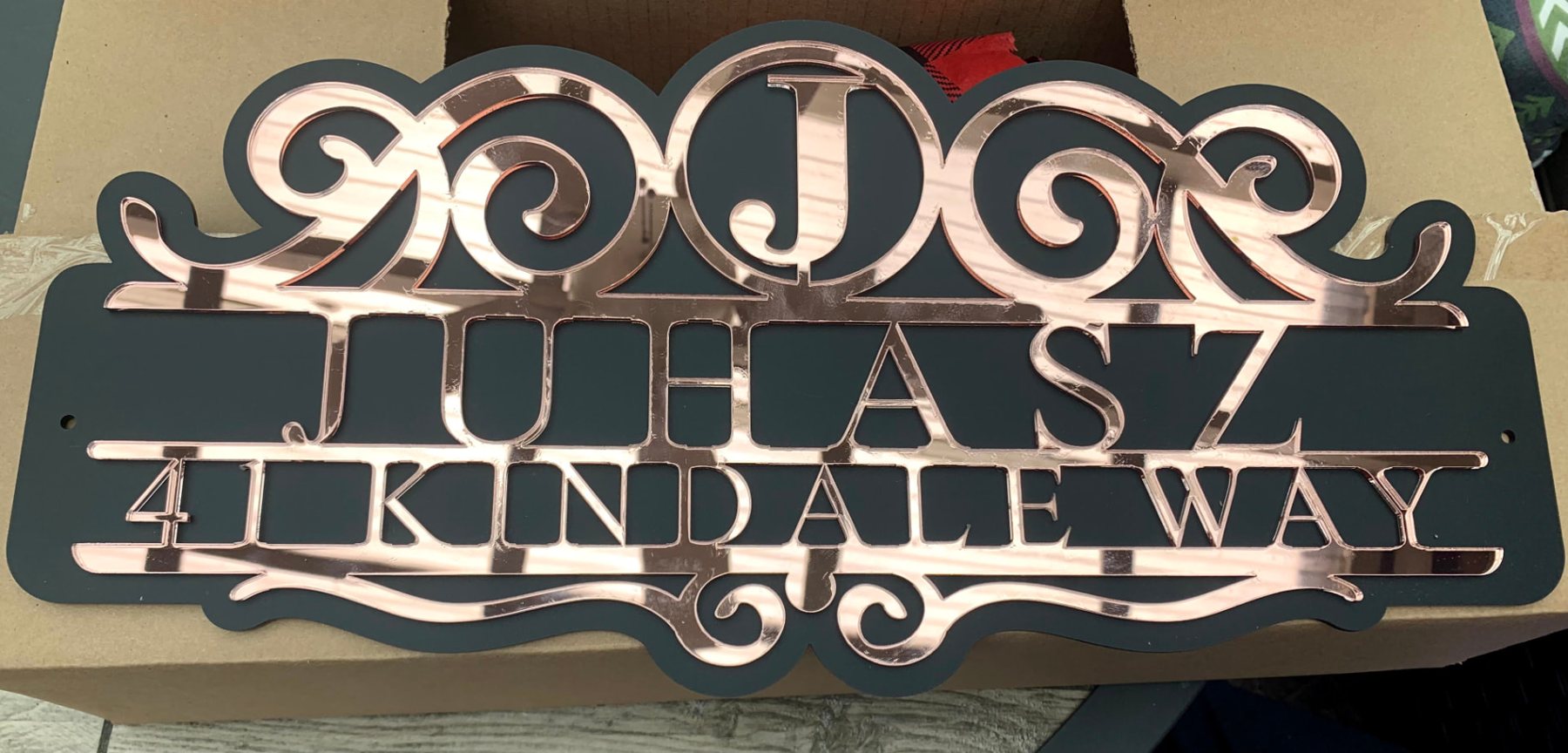 Juhasz address sign in rose mirror acrylic on charcoal backing